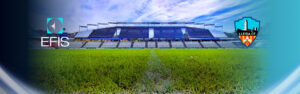 Stadium view with grass foreground.